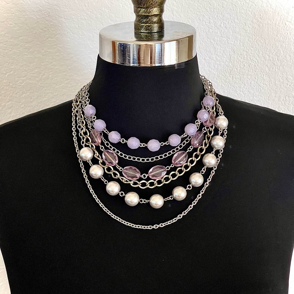 Multi strand necklace with beads and silver toned chains, adjustable clasp